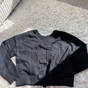 Elegant Black Sweater with Bow Accents